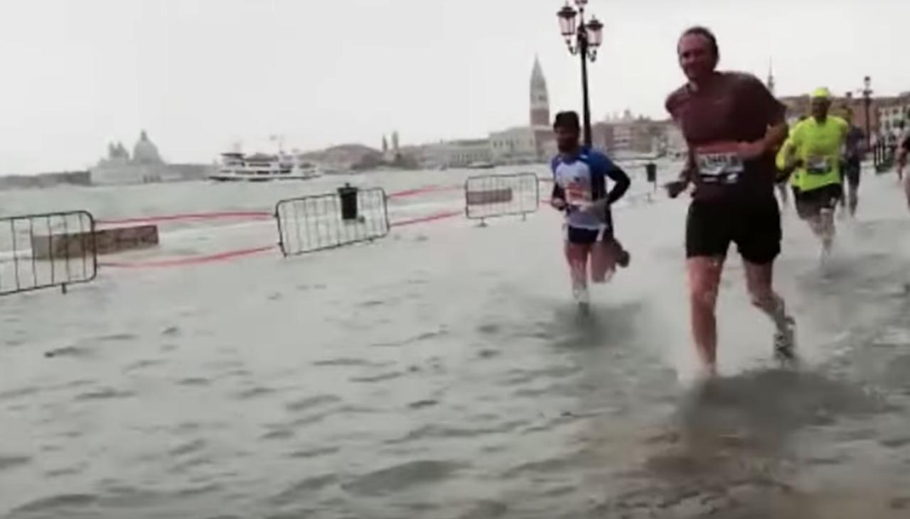 Venice Marathon runners race through flooded streets Newshub
