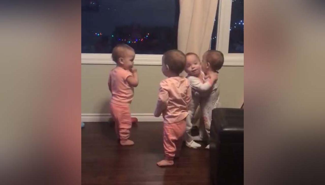 Quadruplets' hug fest caught on camera in adorable video | Newshub