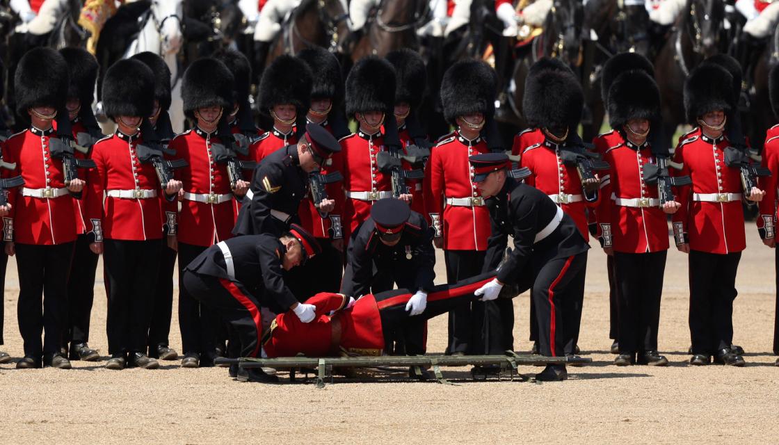 At least three British guardsmen faint in military parade as London ...